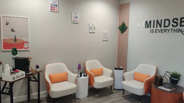 a living room with furniture a rug and a table