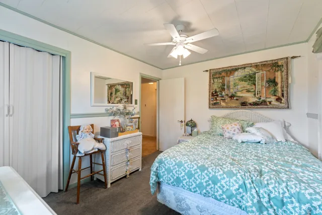 a bathroom with a toilet a sink and a mirror