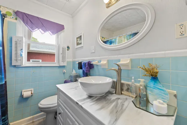 a bedroom with a bed a study table and bookshelf