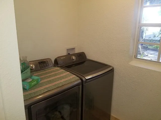 a utility room with dryer and washer