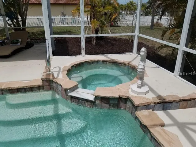 a view of house with backyard porch and seating area