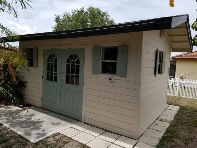 a view of front door and yard