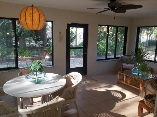 a view of a dining room with furniture wooden floor and chandelier