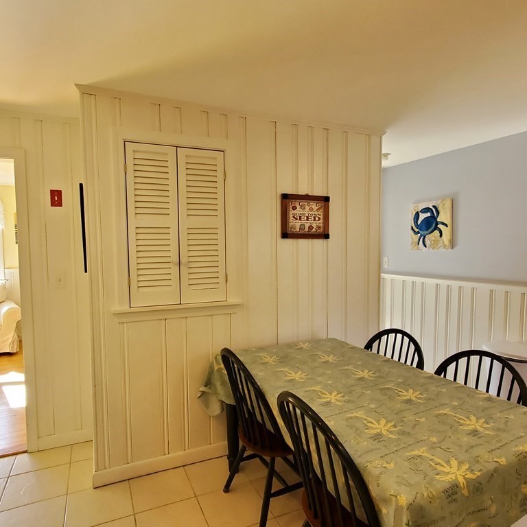 45 Nipigon Way West Dennis, MA 02639 - Photo 13 of 42 a view of a dining room with furniture and window