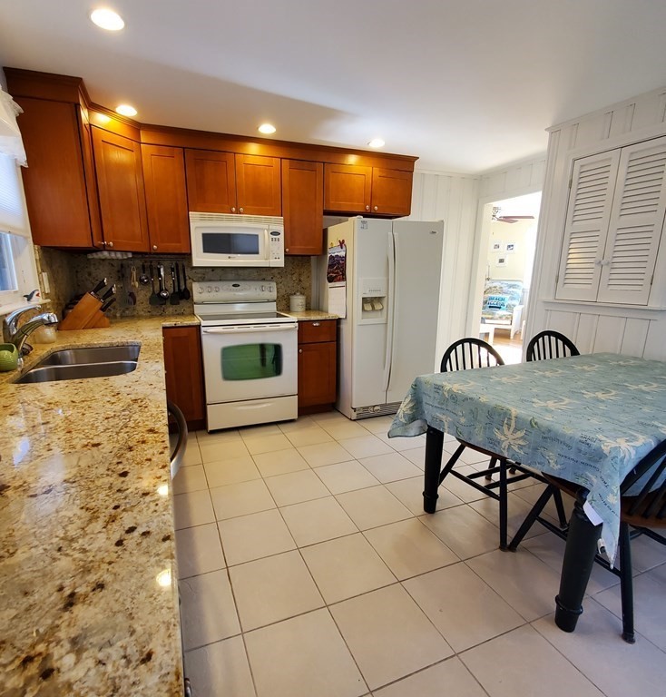 45 Nipigon Way West Dennis, MA 02639 - Photo 17 of 42 a kitchen with stainless steel appliances a stove a sink and a refrigerator