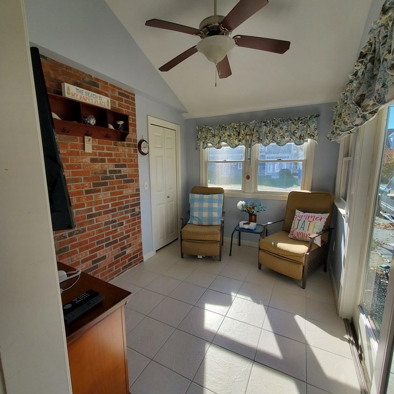 45 Nipigon Way West Dennis, MA 02639 - Photo 18 of 42 a living room with furniture and a fireplace