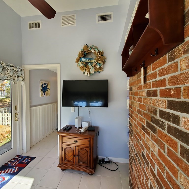 45 Nipigon Way West Dennis, MA 02639 - Photo 19 of 42 a living room with furniture and a flat screen tv