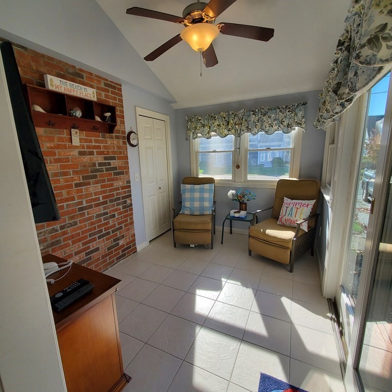 45 Nipigon Way West Dennis, MA 02639 - Photo 20 of 42 a living room with furniture and a flat screen tv