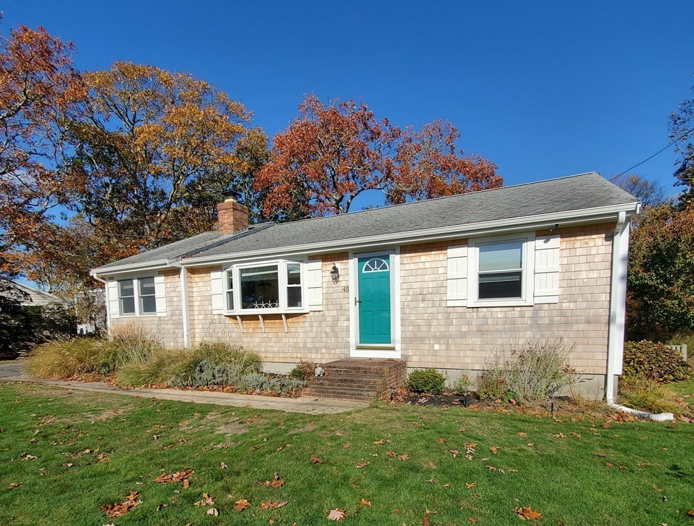 45 Nipigon Way West Dennis, MA 02639 - Photo 2 of 42 a front view of a house with a yard