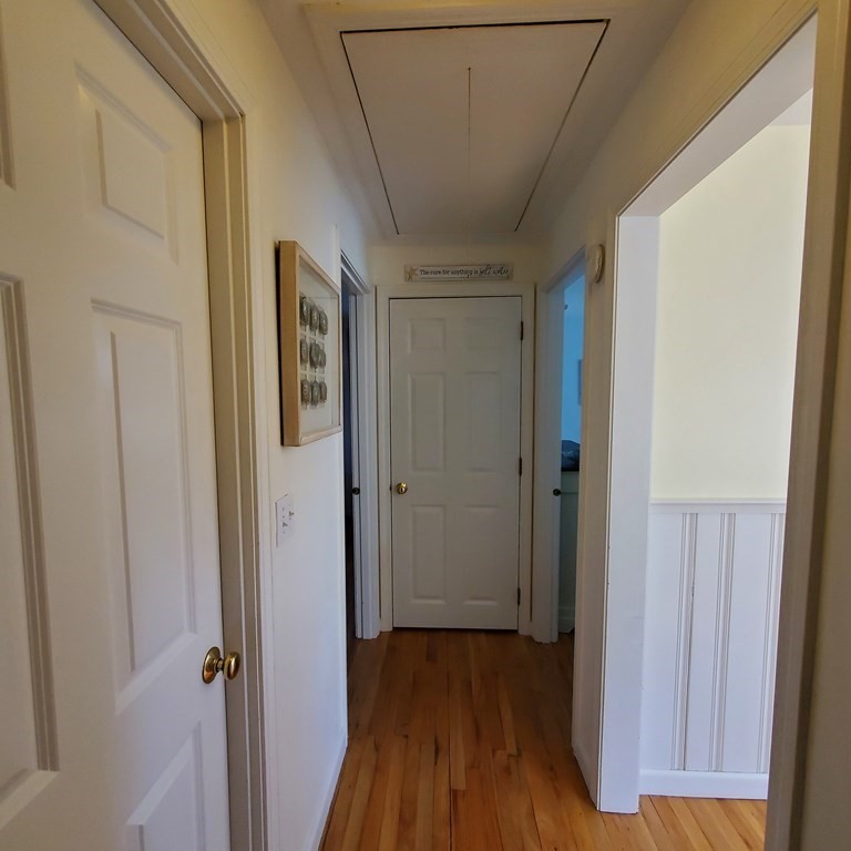 45 Nipigon Way West Dennis, MA 02639 - Photo 28 of 42 a view of a hallway with wooden floor