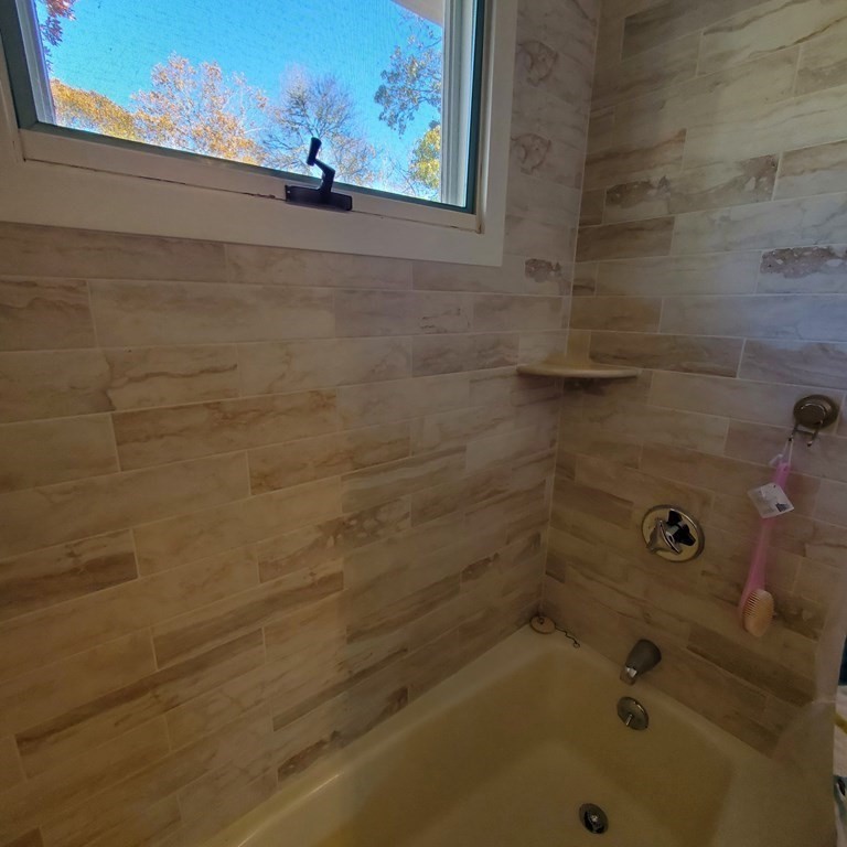 45 Nipigon Way West Dennis, MA 02639 - Photo 30 of 42 a bathroom with a bathtub