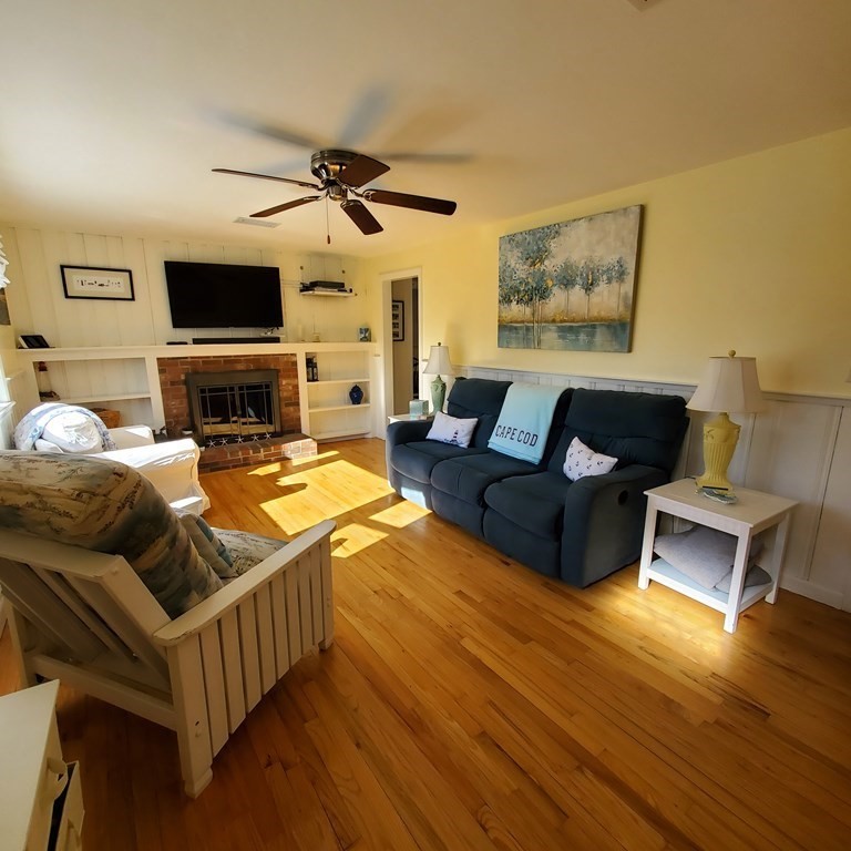 45 Nipigon Way West Dennis, MA 02639 - Photo 3 of 42 a living room with furniture and a flat screen tv