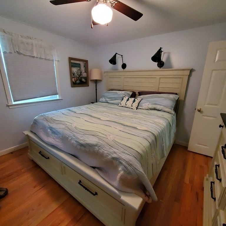 45 Nipigon Way West Dennis, MA 02639 - Photo 31 of 42 a bedroom with bed and wooden floor