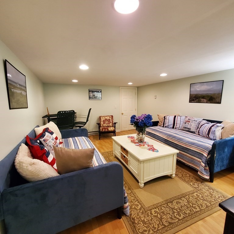 45 Nipigon Way West Dennis, MA 02639 - Photo 35 of 42 a living room with furniture and a rug