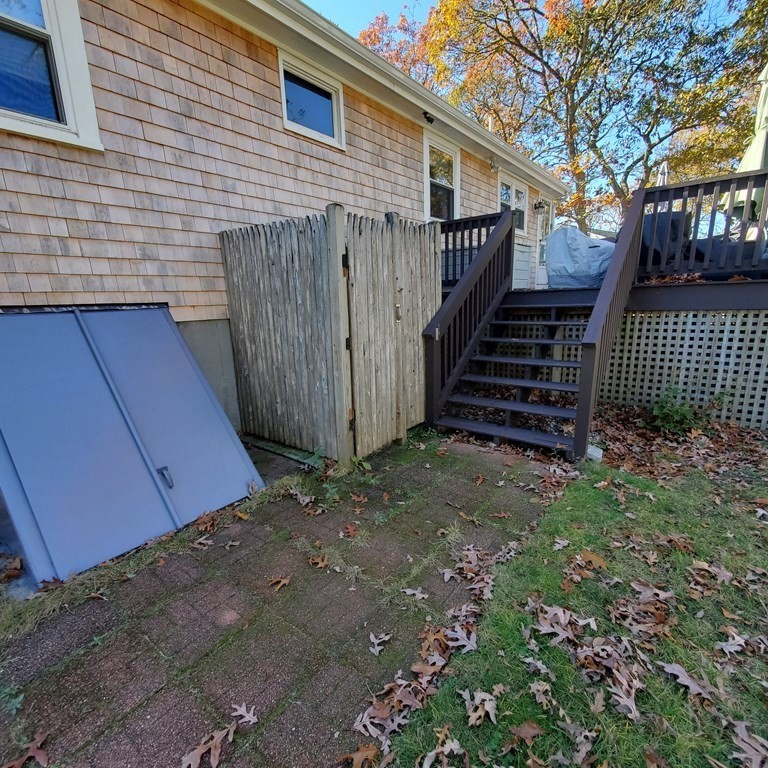 45 Nipigon Way West Dennis, MA 02639 - Photo 40 of 42 a view of a house with a yard