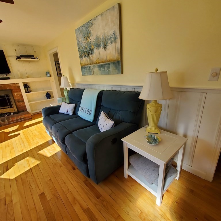 45 Nipigon Way West Dennis, MA 02639 - Photo 5 of 42 a living room with furniture and a wooden floor