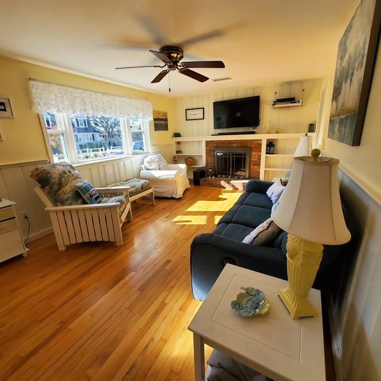 45 Nipigon Way West Dennis, MA 02639 - Photo 8 of 42 a living room with furniture and a flat screen tv