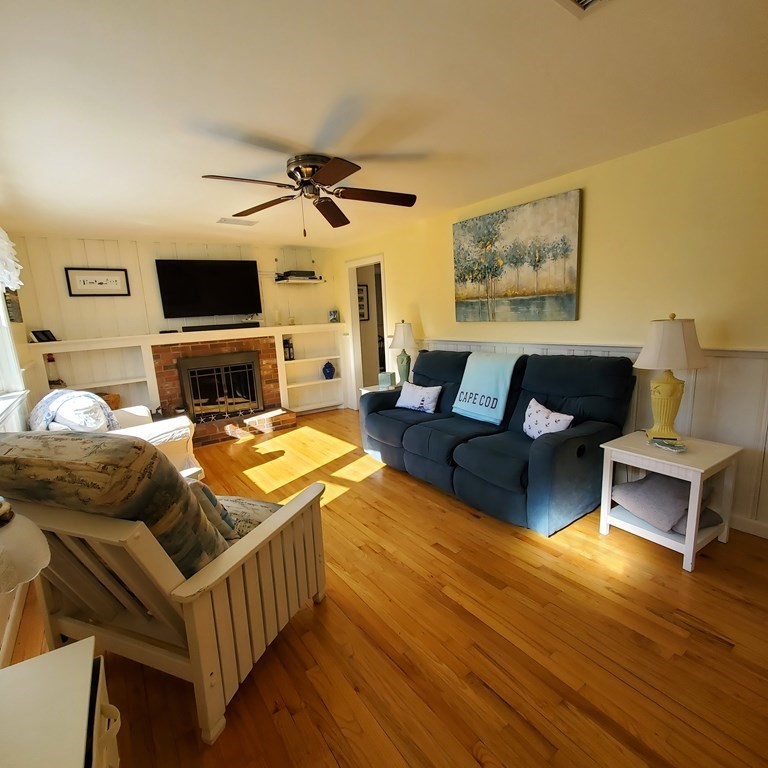 45 Nipigon Way West Dennis, MA 02639 - Photo 9 of 42 a living room with furniture and a flat screen tv