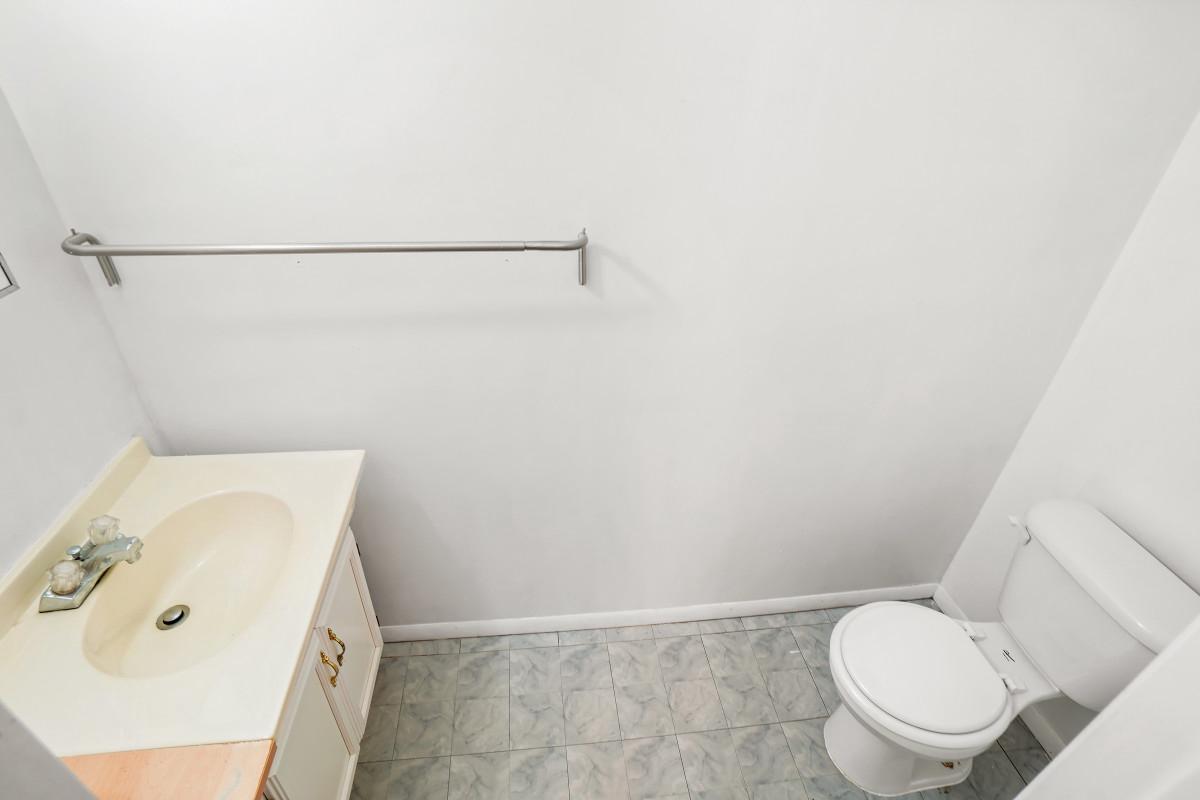 35 Bellfalls Way Nottingham, MD 21236 - Photo 27 of 30 a bathroom with a toilet and a sink