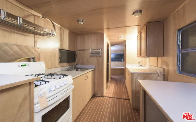 a view of a room with wooden floor and staircase
