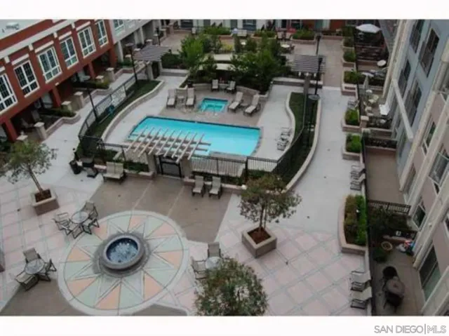 a view of a street with cars parked