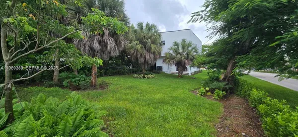 a backyard of a house with lots of green space