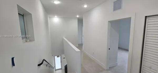 a view of hallway with stairs