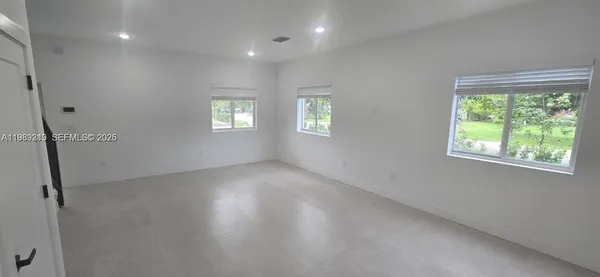 an empty room with windows