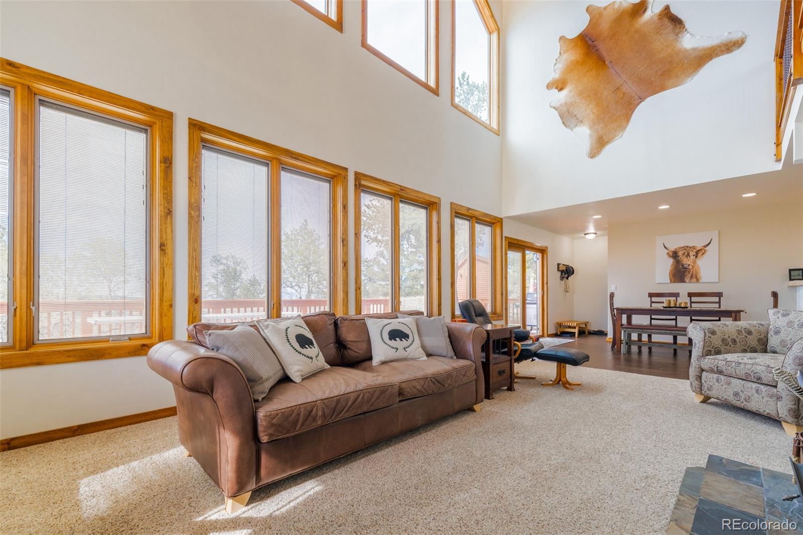 8221 Remington Road Como, CO 80432 - Photo 12 of 49 a living room with furniture and large windows