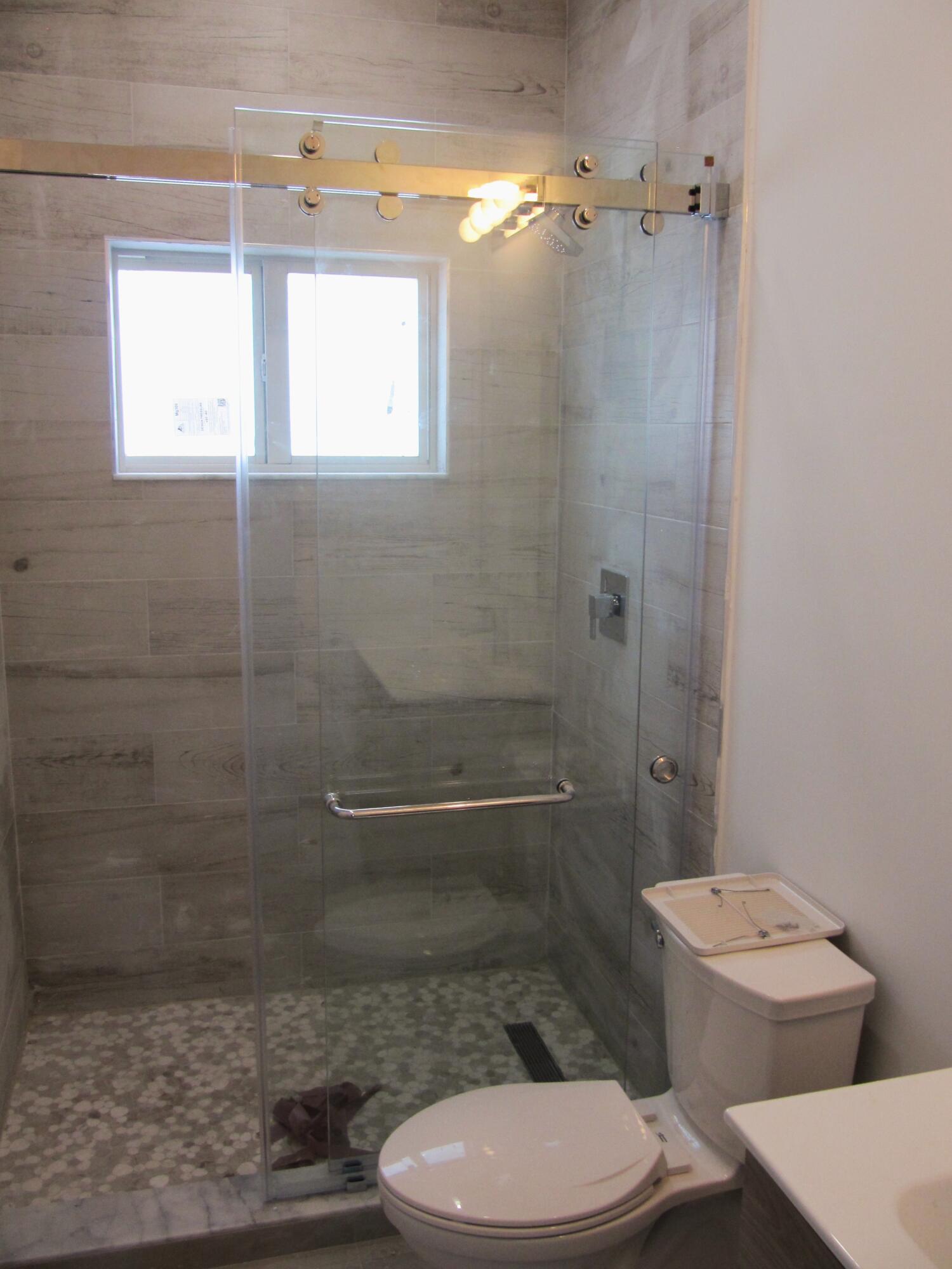 21 Tina Place Key Largo, FL 33037 - Photo 12 of 15 a bathroom with a toilet and a shower