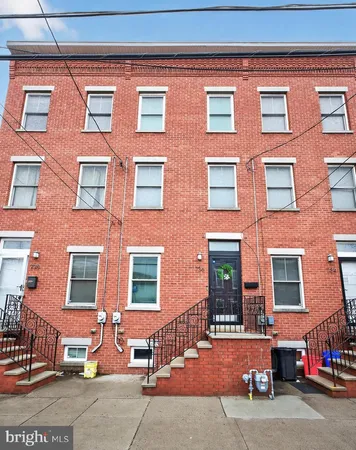 a red brick building that has lot of windows on it
