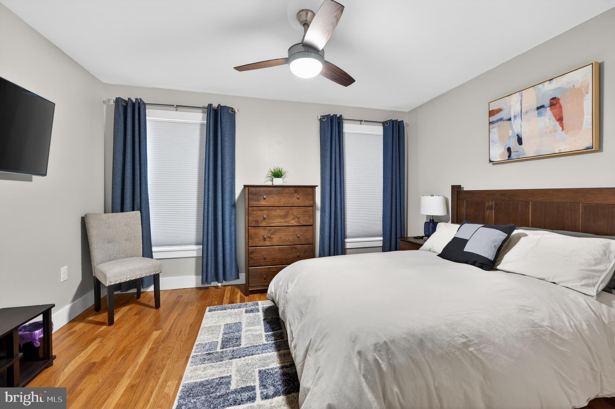 736 New Street Camden, NJ 08103 - Photo 13 of 20 a bedroom with a bed and a chandelier