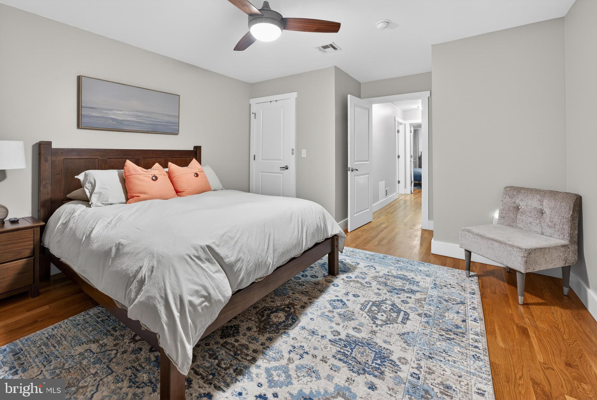 736 New Street Camden, NJ 08103 - Photo 18 of 20 a bedroom with a bed and a table in it