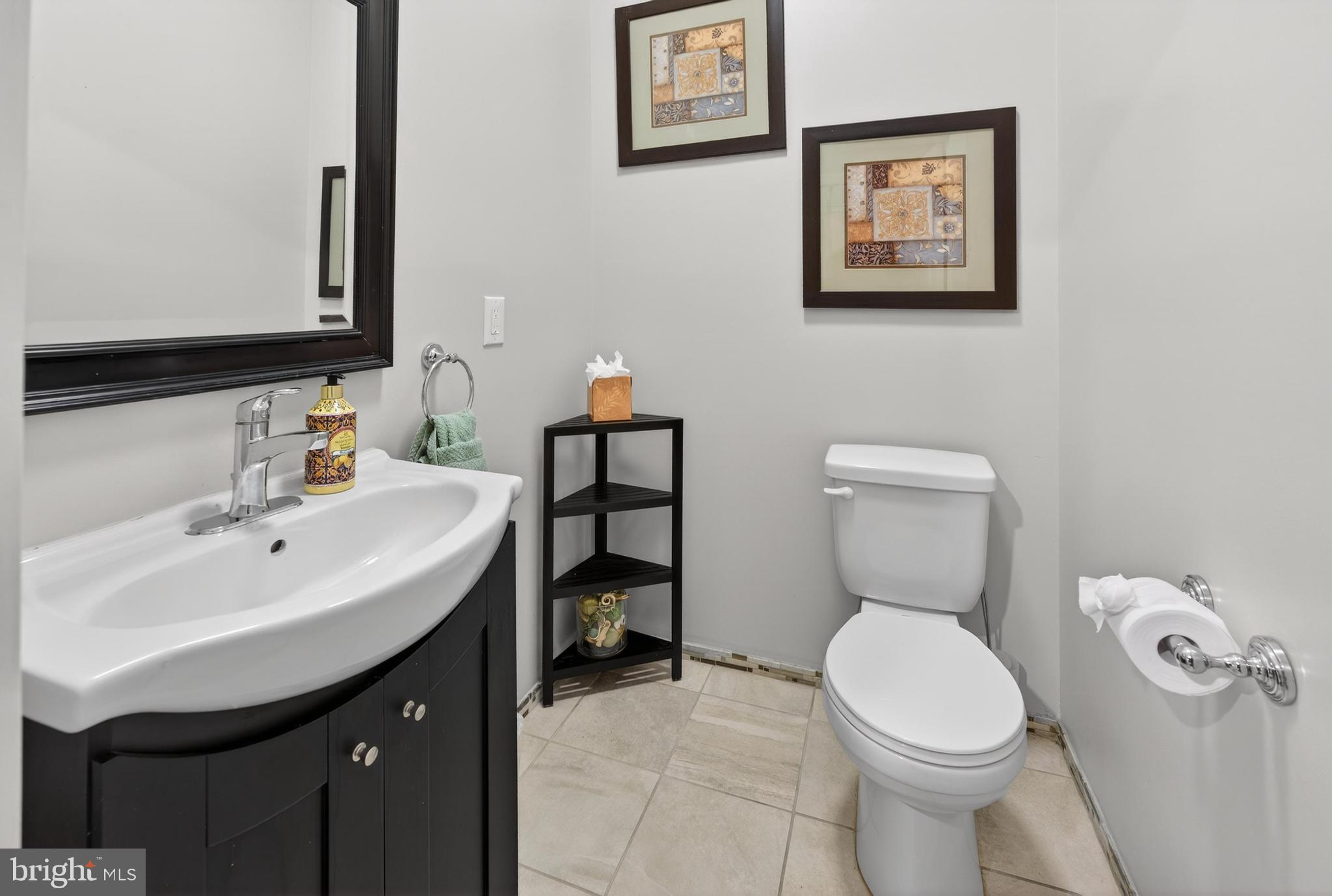 736 New Street Camden, NJ 08103 - Photo 9 of 20 a bathroom with a toilet sink and mirror