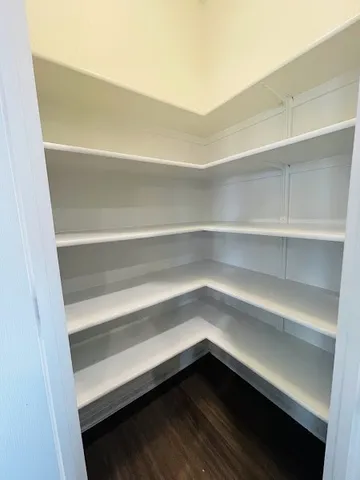 a storage room with wooden floor