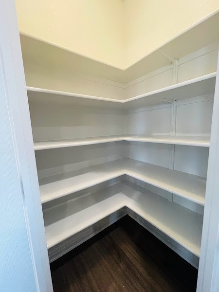 4012 Birdwatch Loop, Unit 8 Pflugerville, TX 78660 - Photo 12 of 23 a storage room with wooden floor