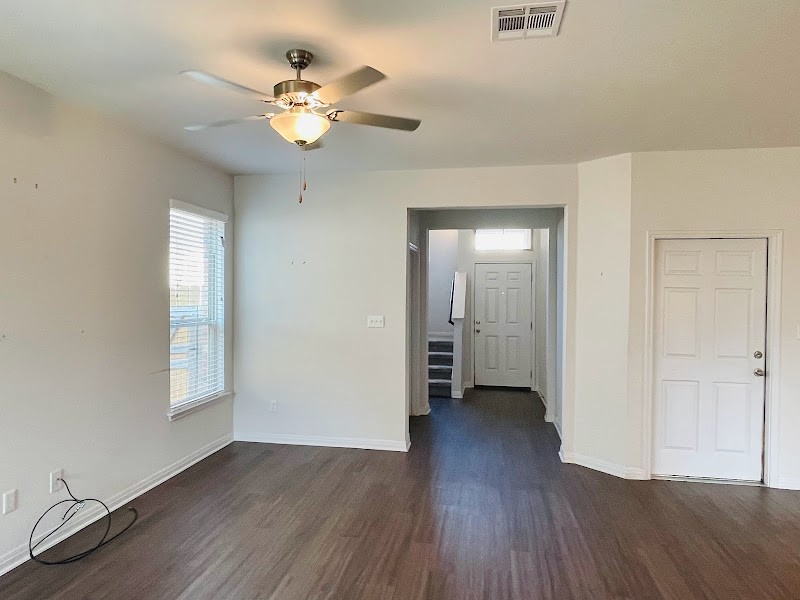 4012 Birdwatch Loop, Unit 8 Pflugerville, TX 78660 - Photo 17 of 23 wooden floor in an empty room with a window