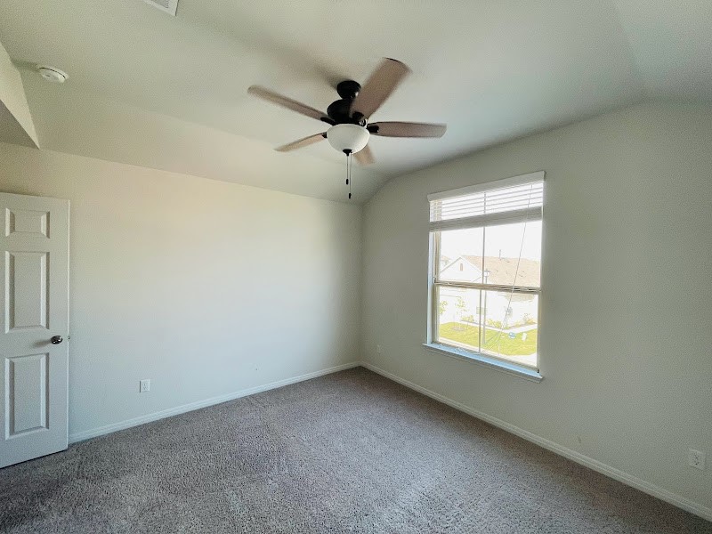 4012 Birdwatch Loop, Unit 8 Pflugerville, TX 78660 - Photo 21 of 23 an empty room with a window and a fan
