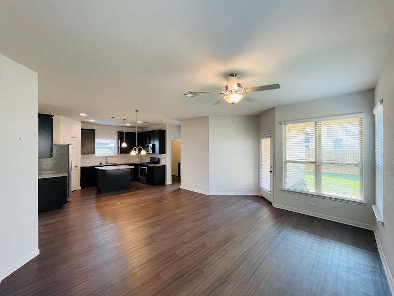 4012 Birdwatch Loop, Unit 8 Pflugerville, TX 78660 - Photo 5 of 23 a view of a kitchen with a sink cabinets and kitchen view