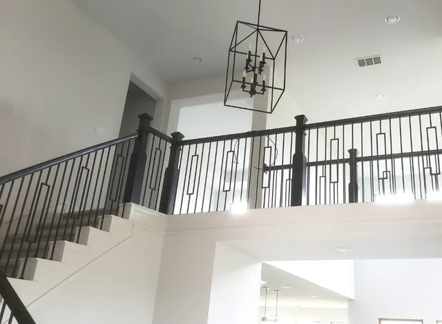 a view of a hallway with furniture and wooden floor
