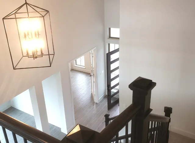 a view of a hallway with stairs