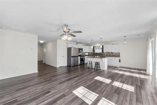 a view of kitchen with cabinets and wooden floor