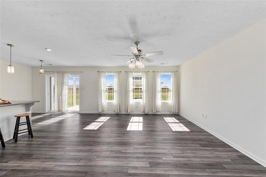 1024 Colonial Drive Uniontown, PA 15401 - Photo 12 of 33 a view of an empty room with window and wooden floor