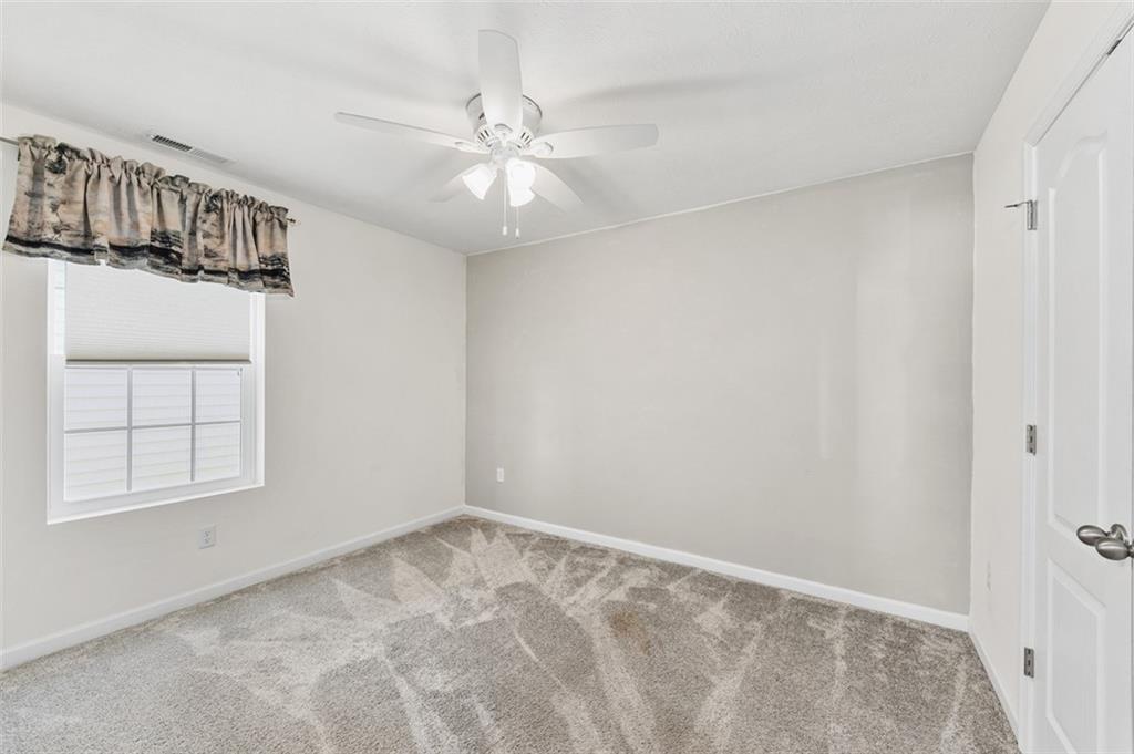 1024 Colonial Drive Uniontown, PA 15401 - Photo 24 of 33 an empty room with windows and fan