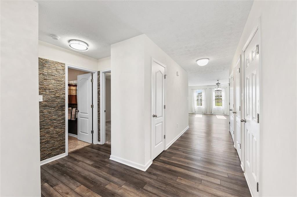 1024 Colonial Drive Uniontown, PA 15401 - Photo 3 of 33 a view of a hallway with wooden floor and staircase