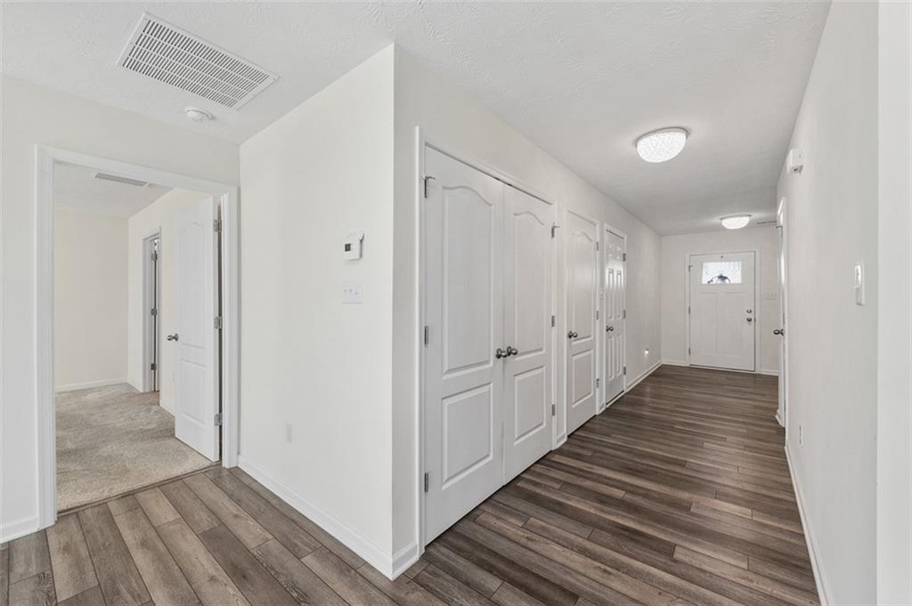 1024 Colonial Drive Uniontown, PA 15401 - Photo 4 of 33 a view of a hallway with wooden floor