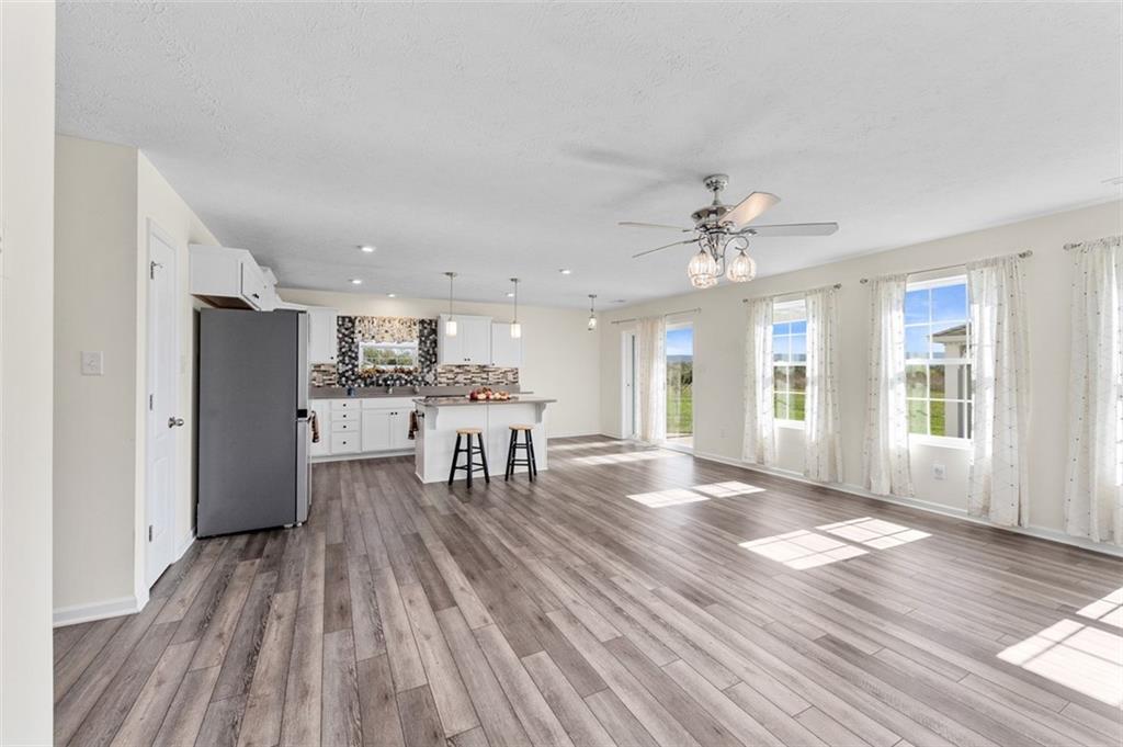 1024 Colonial Drive Uniontown, PA 15401 - Photo 5 of 33 a view of a livingroom with furniture wooden floor and a window