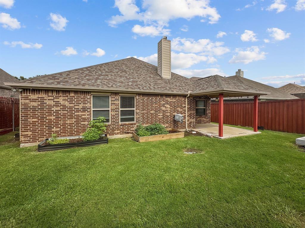 3205 Ridgeway Drive McKinney, TX 75071 - Photo 27 of 27 a front view of a house with a garden