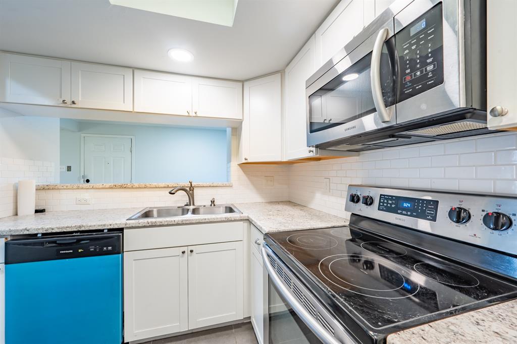 8600 Fathom Circle, Unit 1407 Austin, TX 78750 - Photo 11 of 26 a kitchen with a stove and a sink