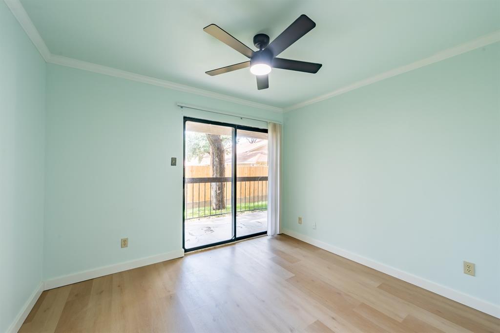 8600 Fathom Circle, Unit 1407 Austin, TX 78750 - Photo 13 of 26 an empty room with wooden floor and ceiling fan